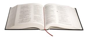 Open bible and ribbon bookmark.