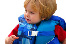 toddler in lifejacket on boat